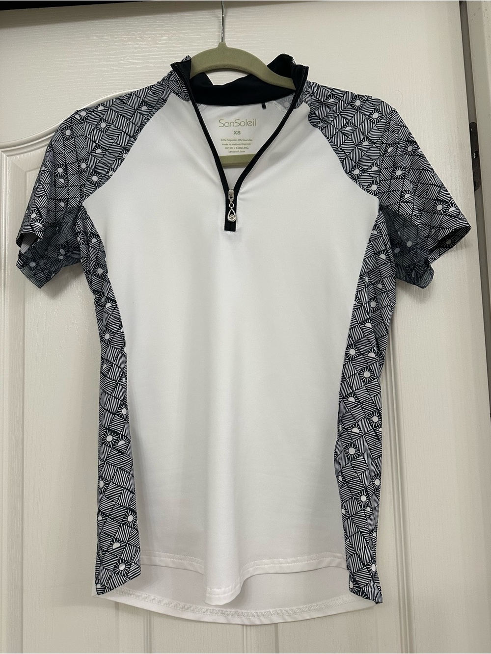 SanSoleil Women's White Short Sleeve Golf Short with Black Geo Panels